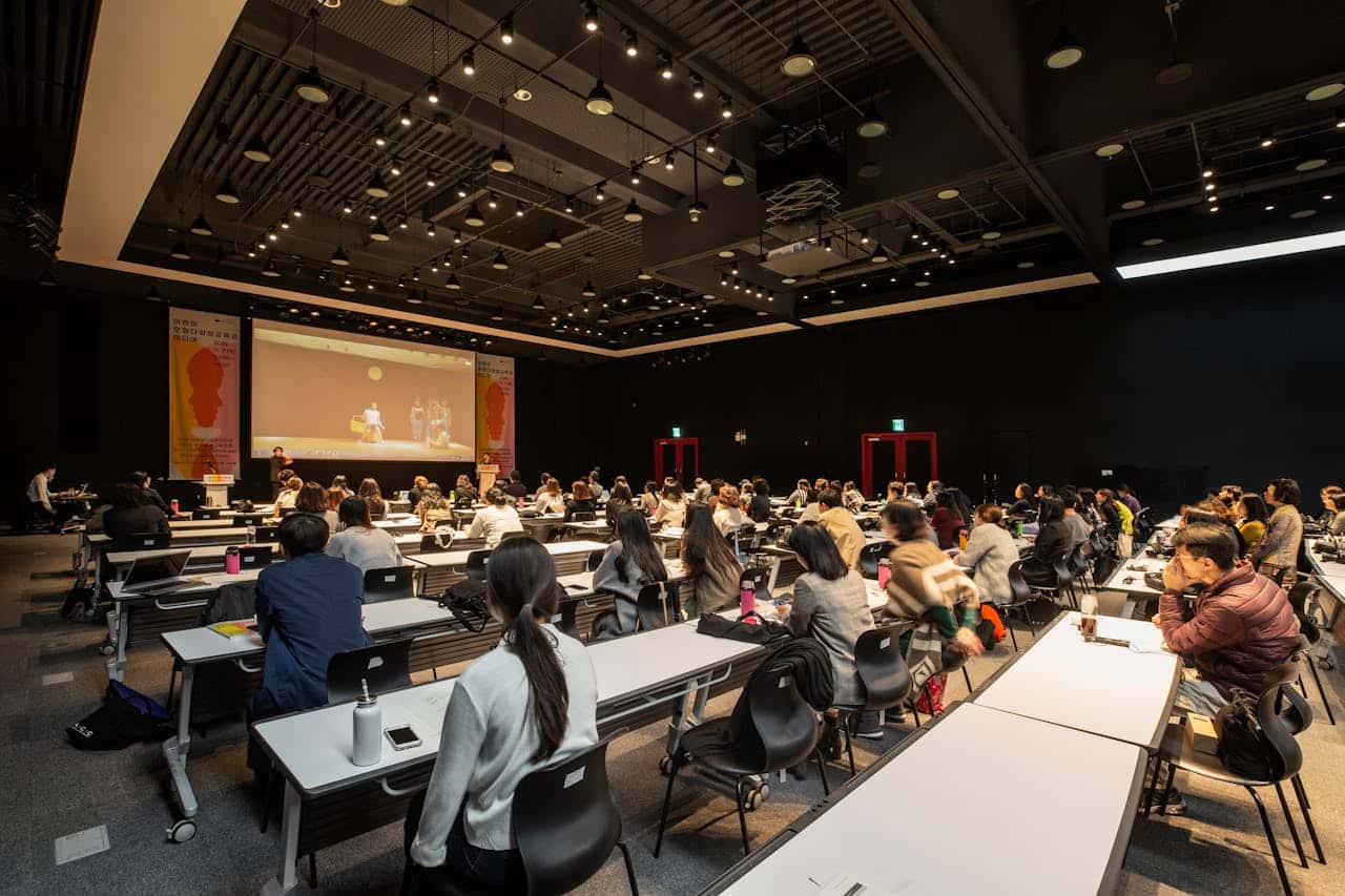 Public health professionals collaborating in a conference setting - Medimagh International Consulting insights and publications